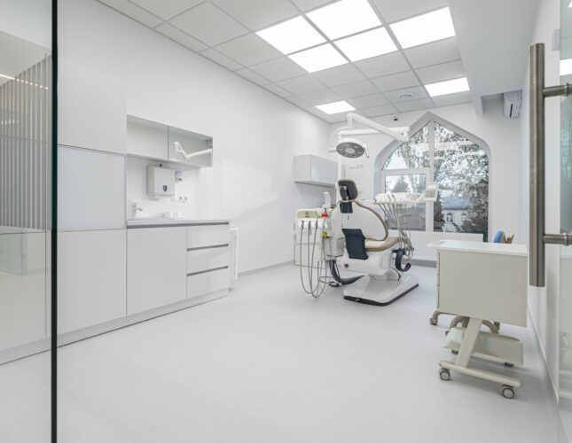 Interior of white modern dentistry medical room with special equipment